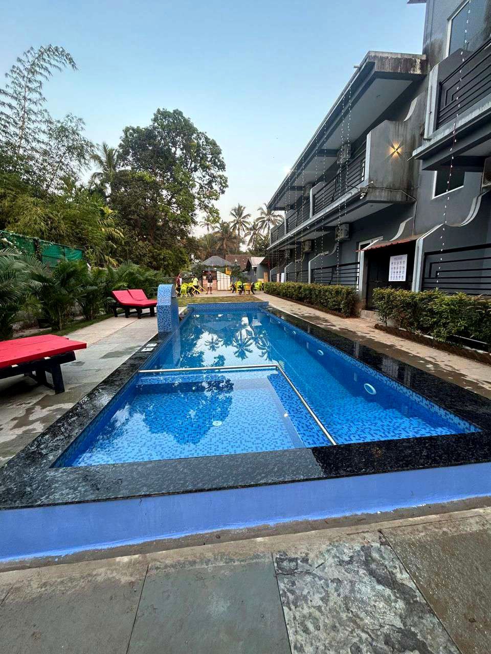 Agusto Beach Stay building beside the swimming pool