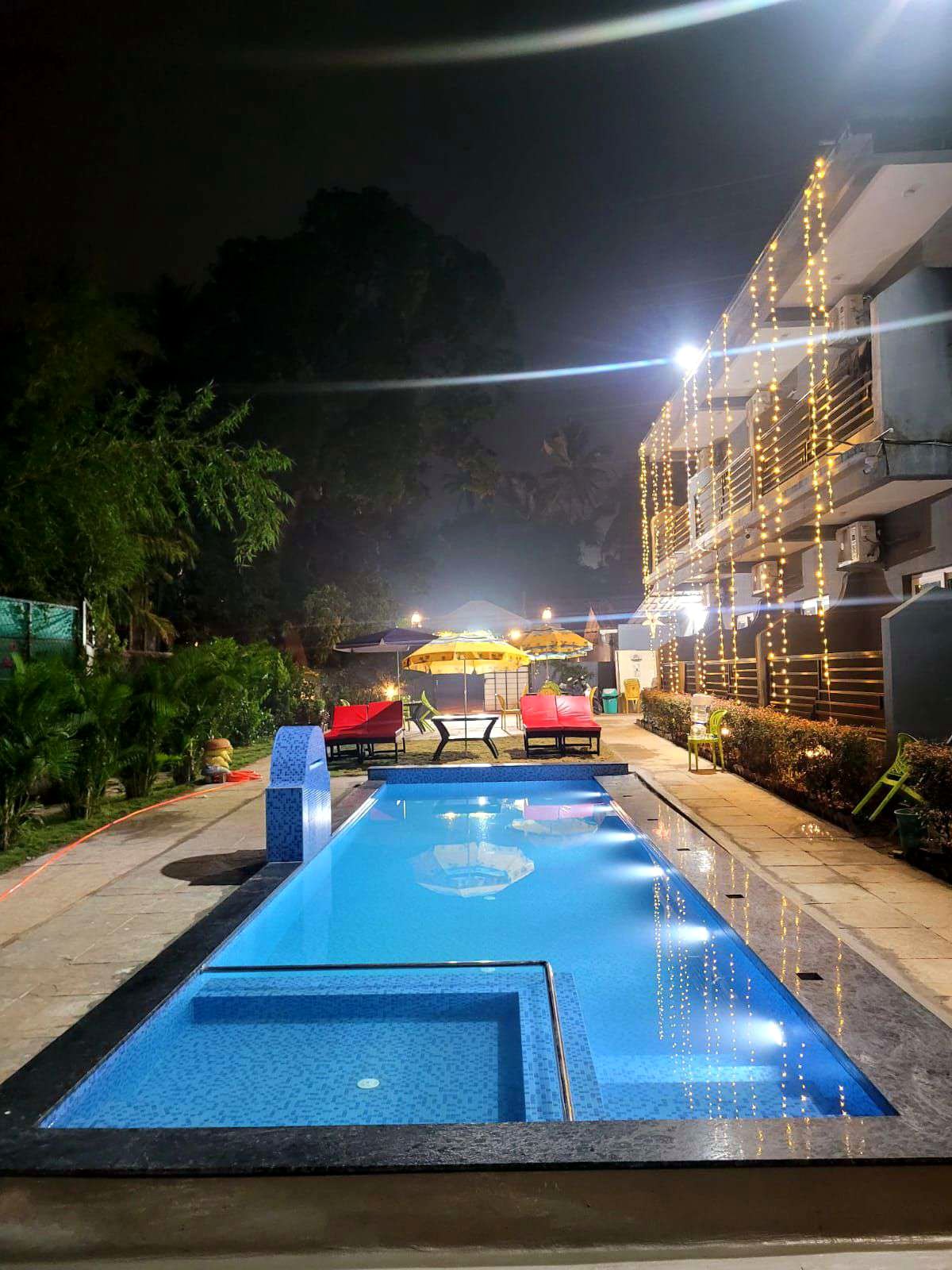 Swimming pool at night with lights
